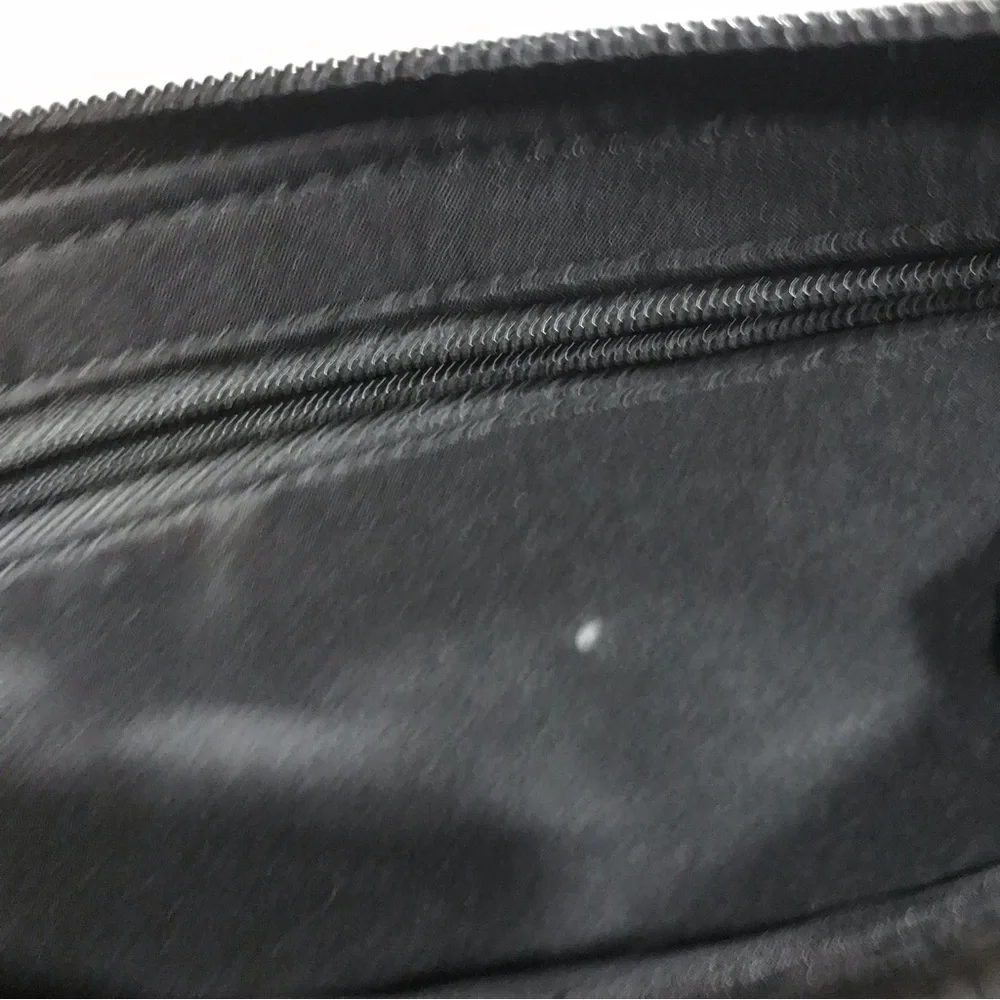 Nine West Black and White Cutout Flower Wristlet. - Picture 4 of 4